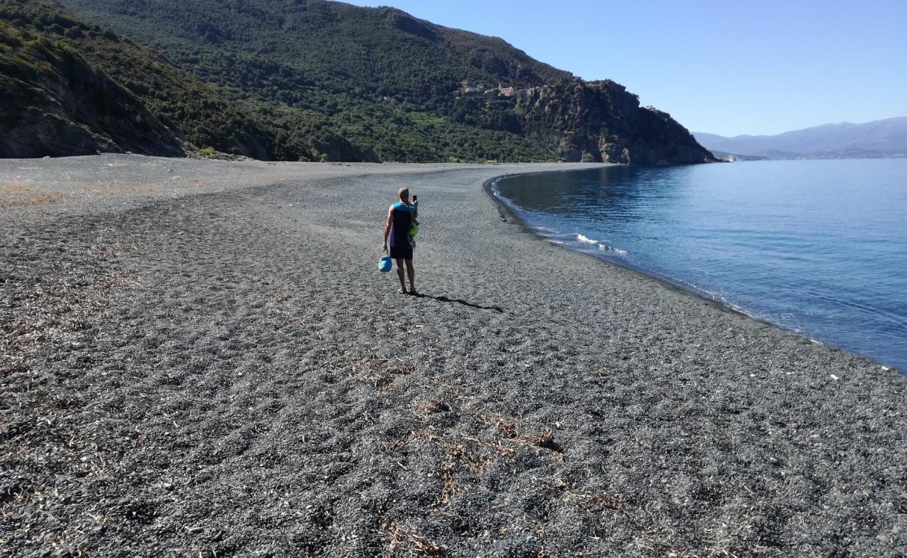 Photo of Nonza Beach with gray pebble surface