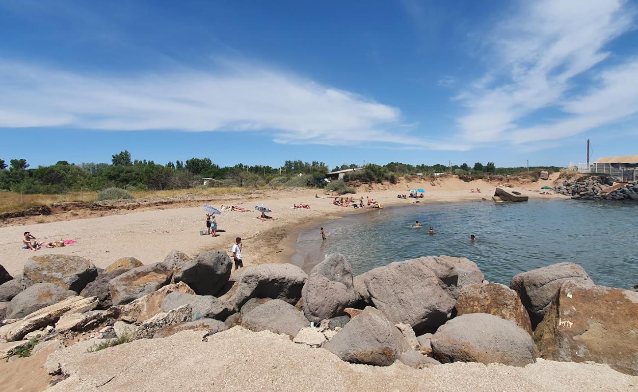 Photo of Roucan Plage with bright sand & rocks surface