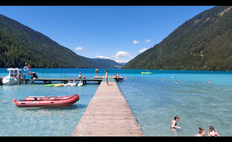 Photo of Freibad Weissensee with bright sand surface