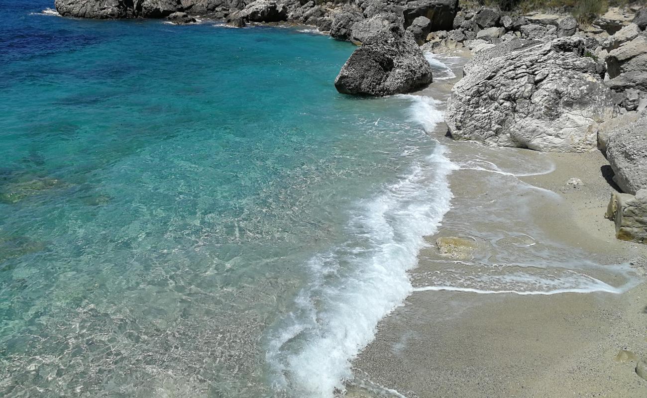 Photo of Spartila beach with bright shell sand surface