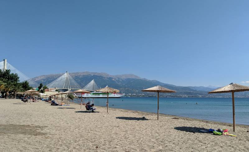 Photo of Antirrio beach with brown sand surface