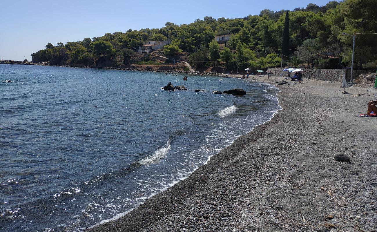 Photo of Paralia Portes with brown sand &  rocks surface