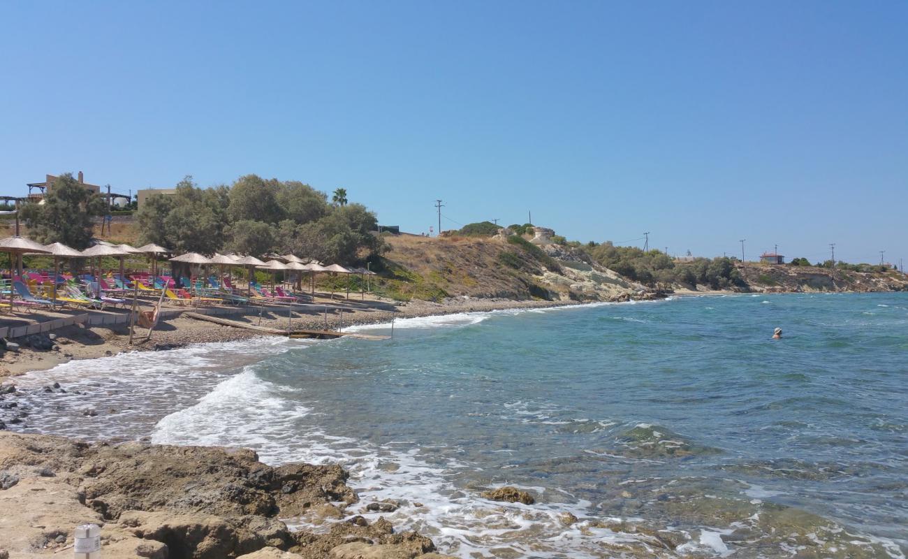 Photo of Kamares beach with brown sand &  rocks surface