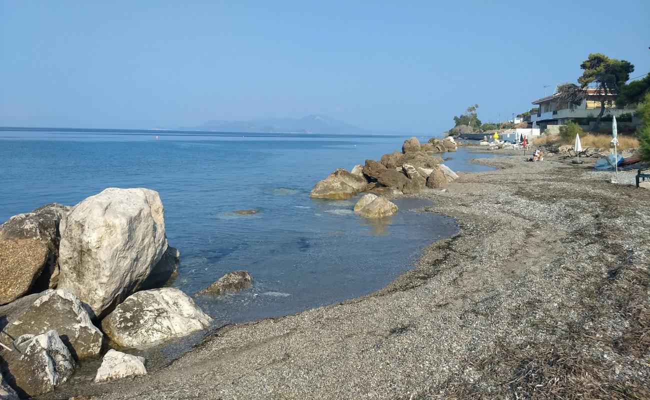 Photo of Melissi Paralia with gray pebble surface