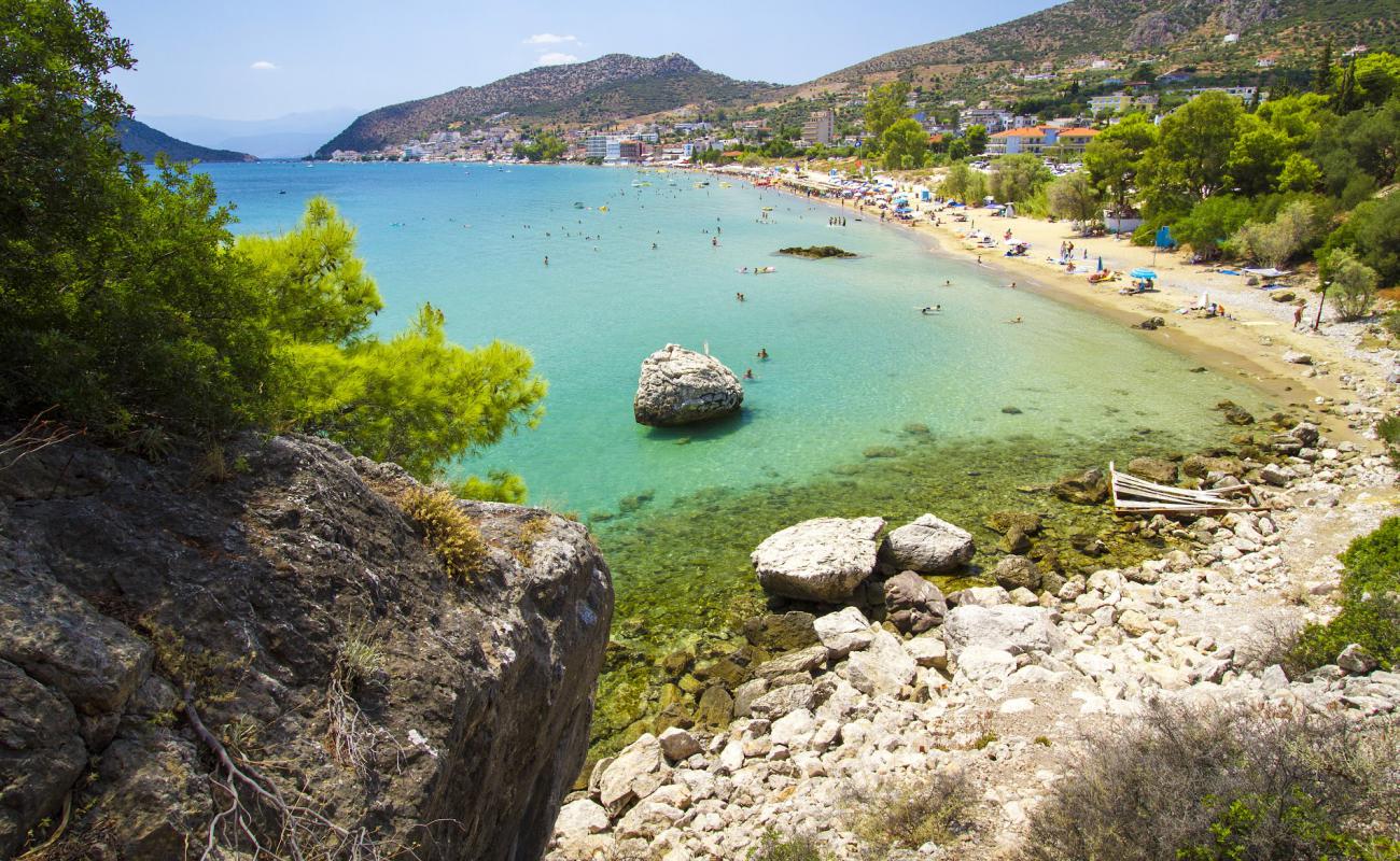 Photo of Tolo Beach with brown fine sand surface