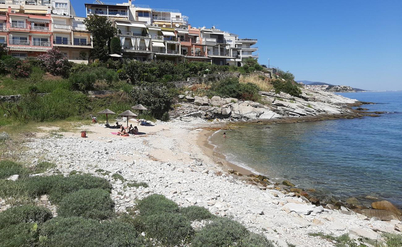 Photo of Kavala beach with bright sand & rocks surface