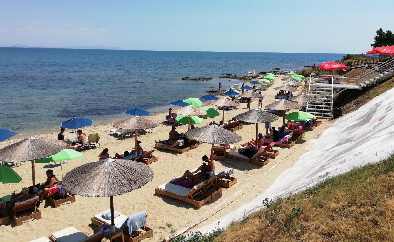 Photo of Paralia Porto Molo with bright sand surface