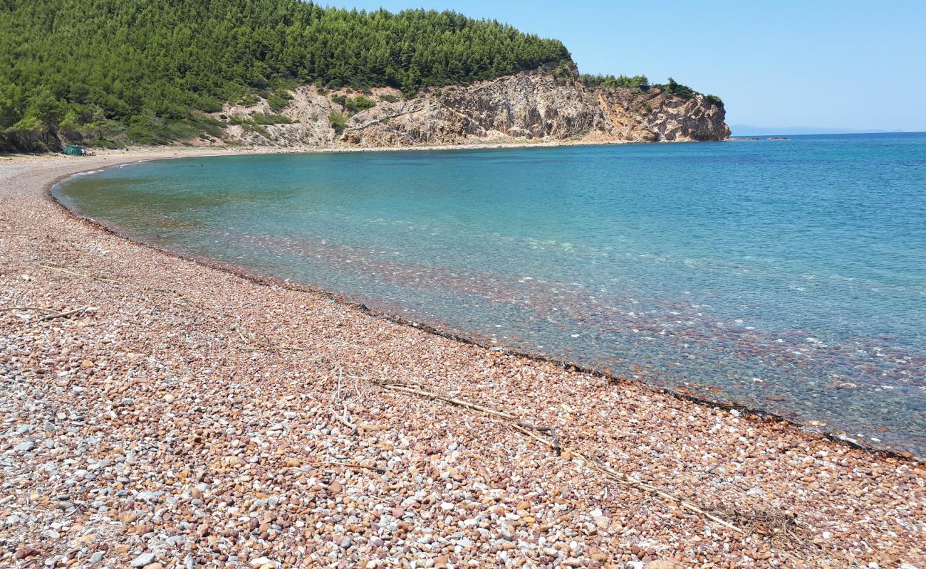 Photo of Mourtias beach with black sand & pebble surface