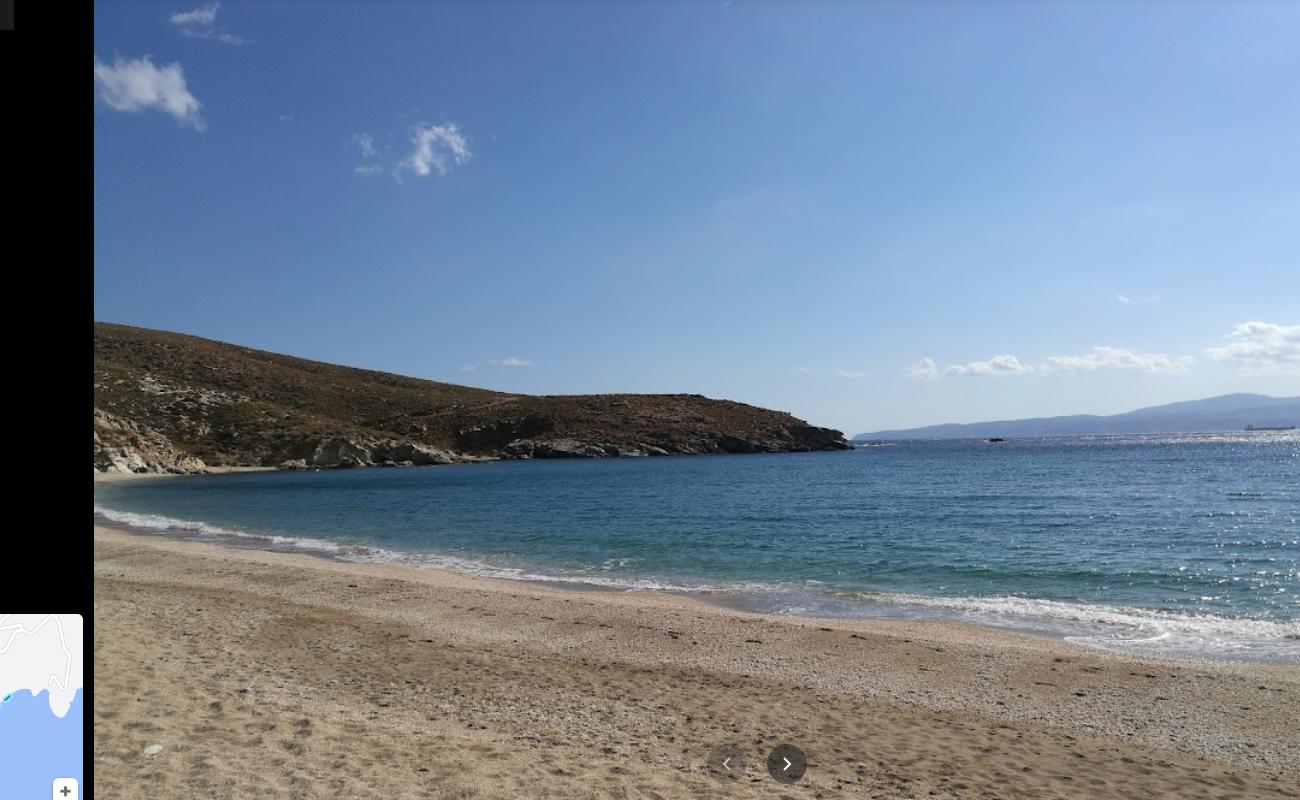 Photo of Livádi beach with bright shell sand surface