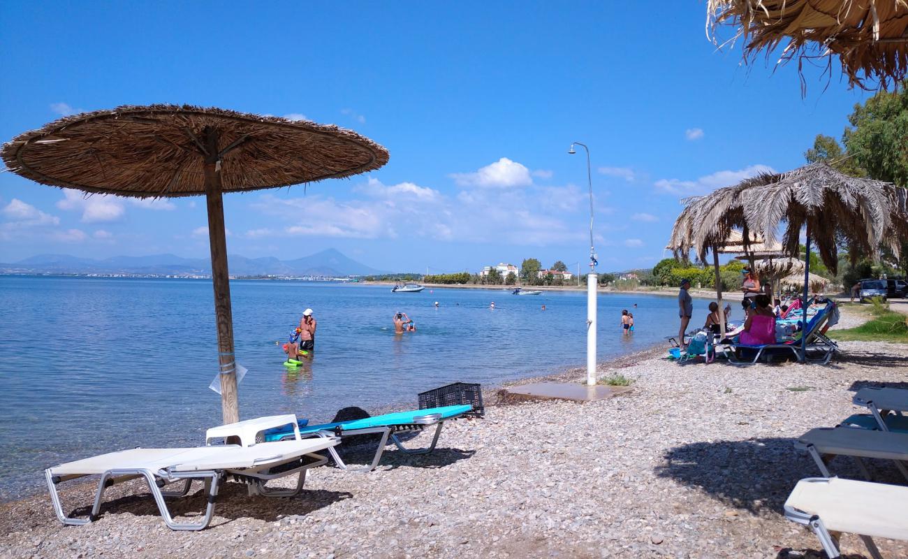 Photo of Agios Andreas beach with gray sand &  pebble surface