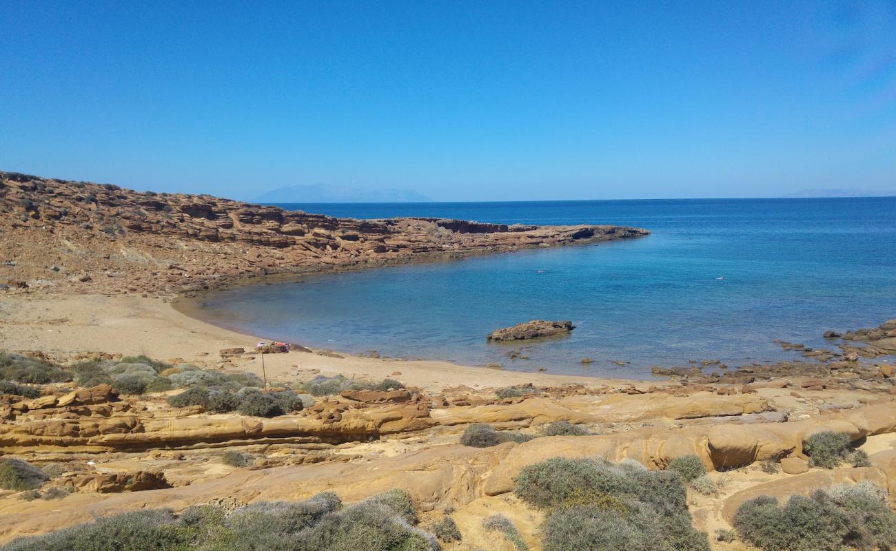 Photo of Faraklou beach with brown sand &  rocks surface