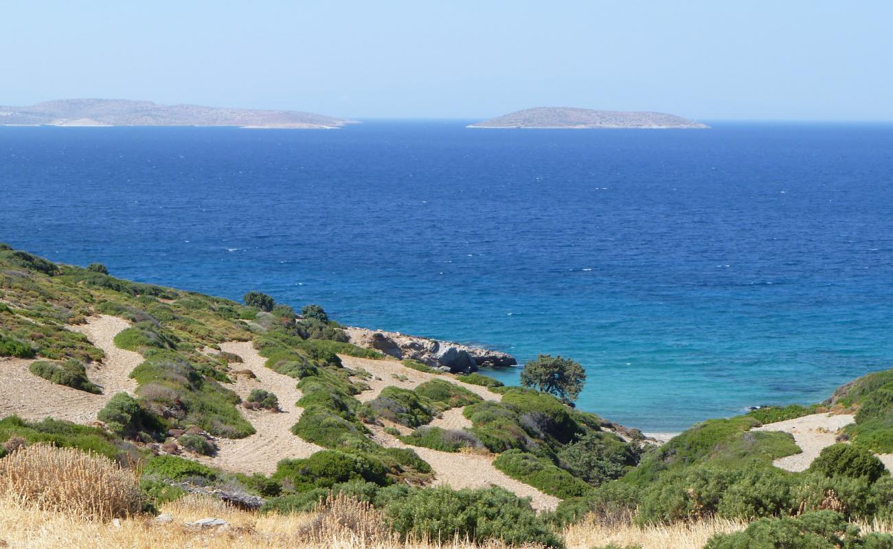 Photo of Leipsoi wild beach III with gray sand &  rocks surface