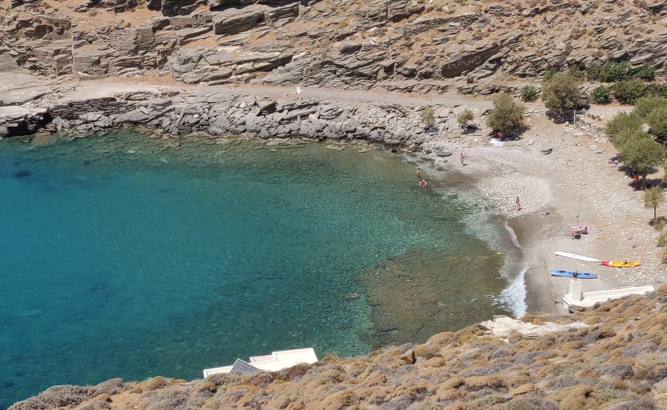 Photo of Vathi beach with gray sand &  rocks surface