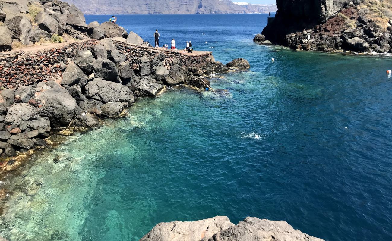 Photo of Ammoudi beach with rocks cover surface