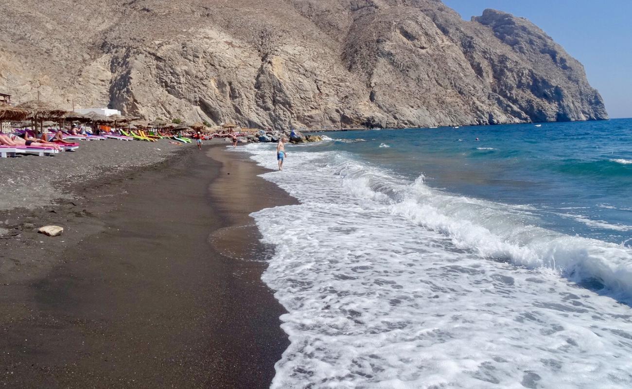 Photo of Perissa beach with gray sand &  pebble surface