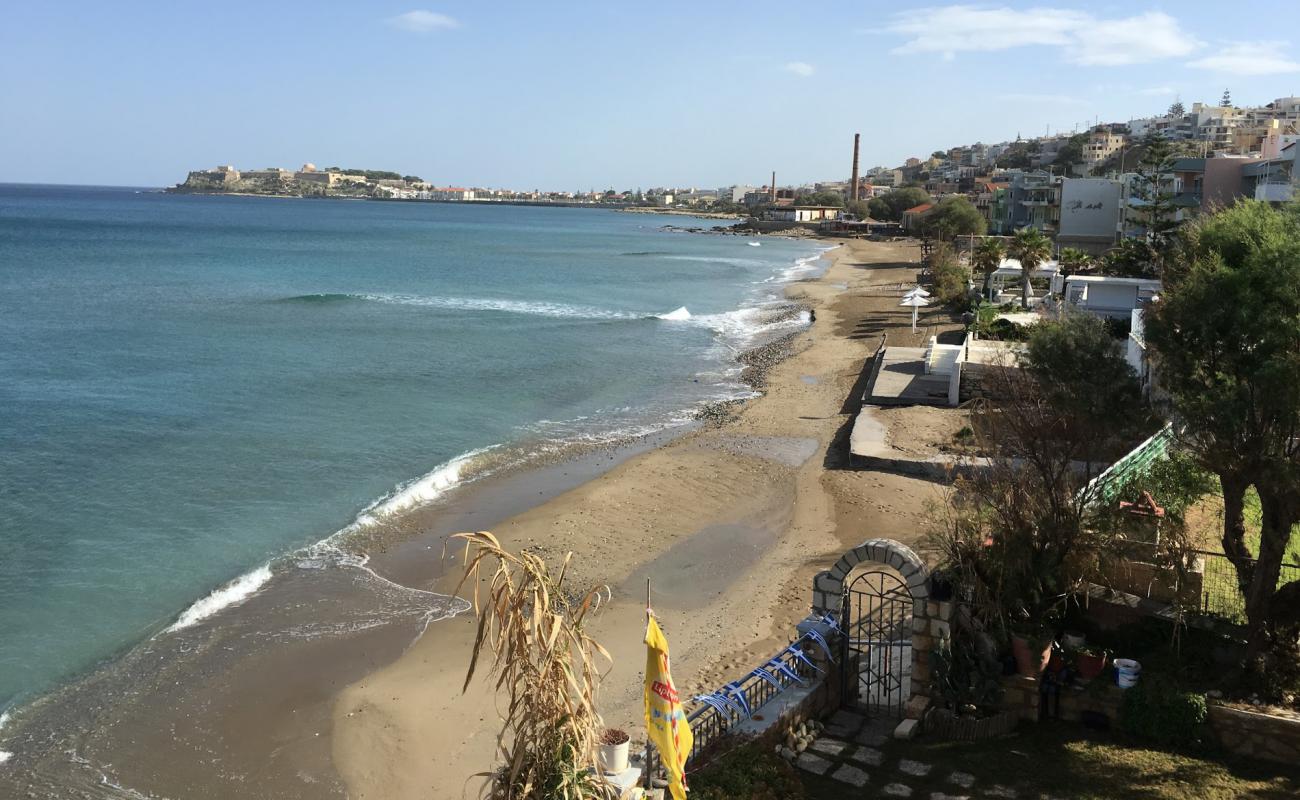 Photo of Koumbes beach with black sand & pebble surface