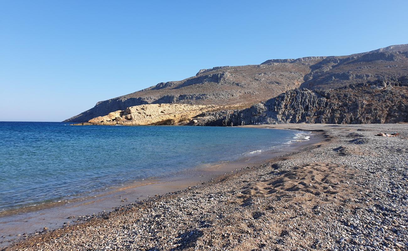 Photo of Karoumes beach with gray sand &  pebble surface