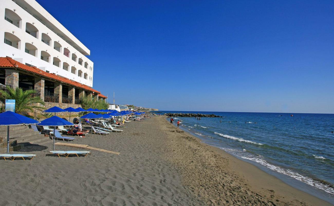 Photo of Paralia Ag. Andreas with bright sand & rocks surface