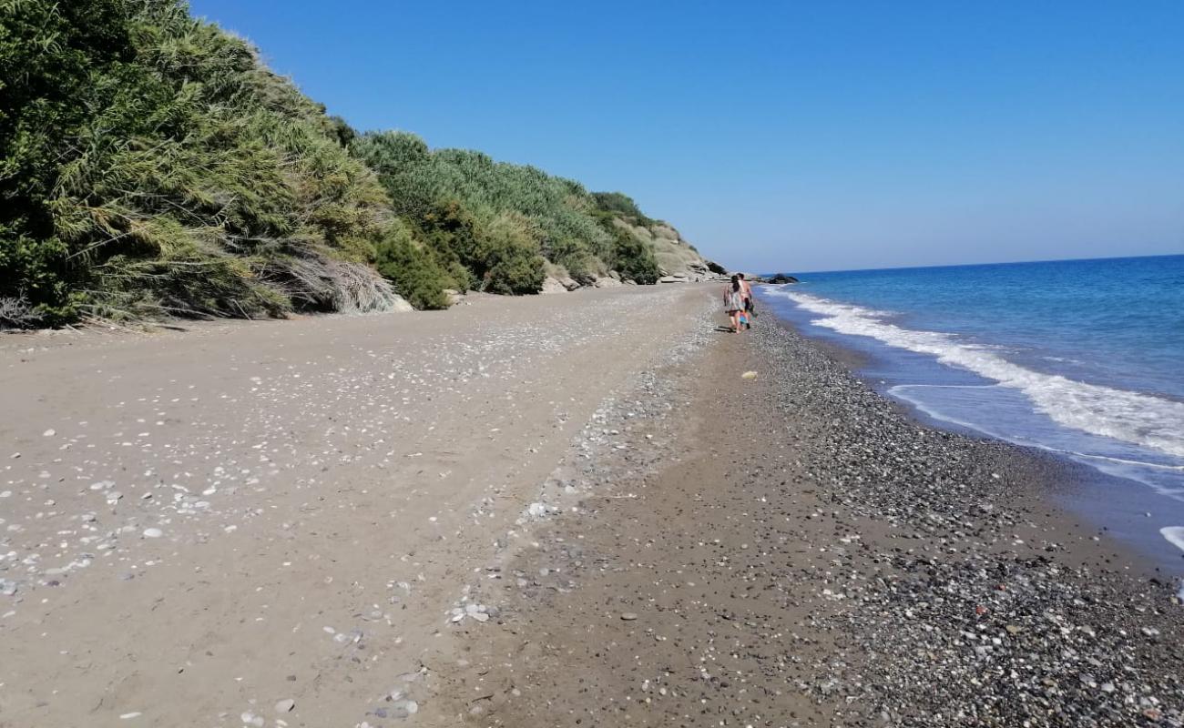 Photo of Ammoudaron beach with black sand & pebble surface