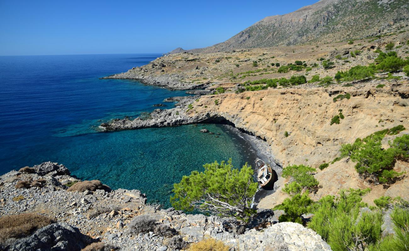 Photo of Ag. Antonios beach with bright sand & rocks surface