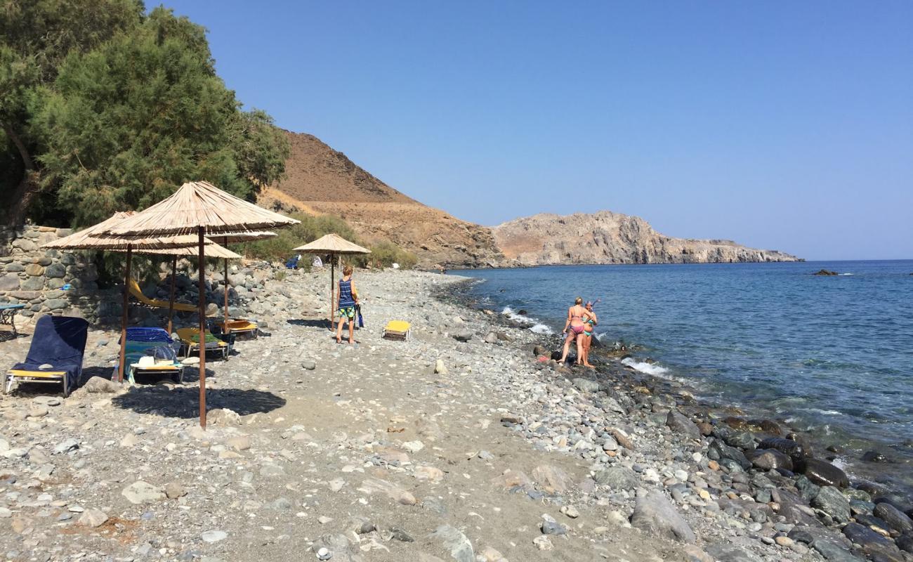 Photo of Paralia Petraki with gray sand &  rocks surface