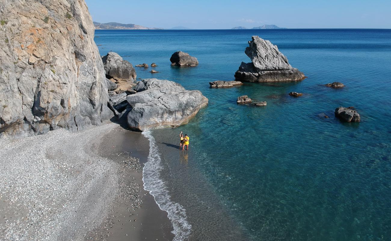 Photo of Vasilis Rock beach with gray sand &  rocks surface