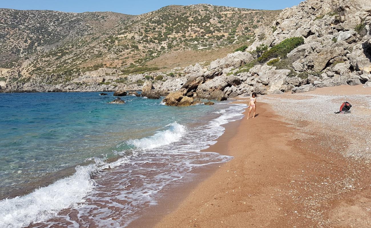 Photo of Kokkino Ammoutsaki with brown sand &  rocks surface