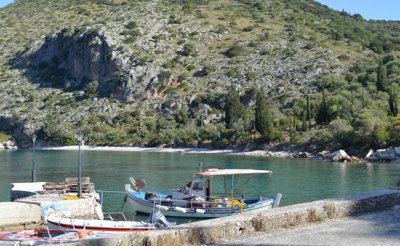 Photo of Aspros Gialos with light sand &  pebble surface