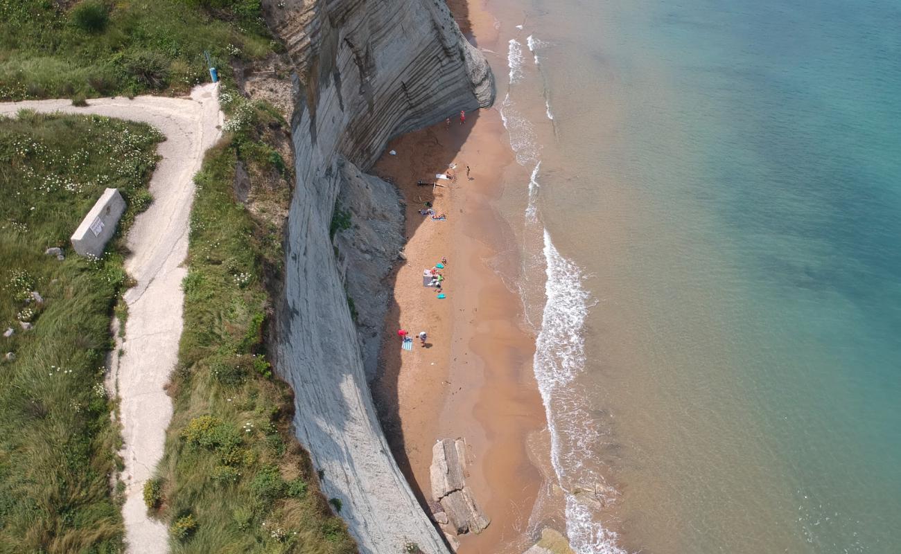 Photo of Logas the Sunset with brown fine sand surface