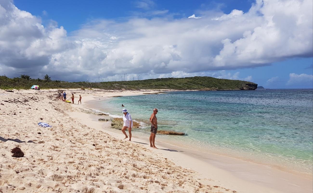 Photo of Plage d'Anse a la Gourde with bright fine sand surface