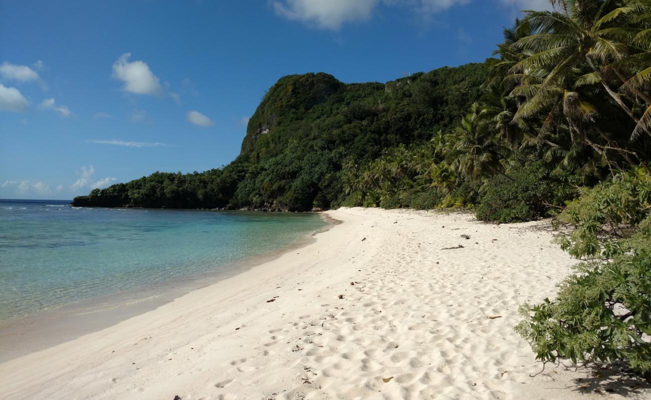 Photo of Haputo Beach with bright sand & rocks surface