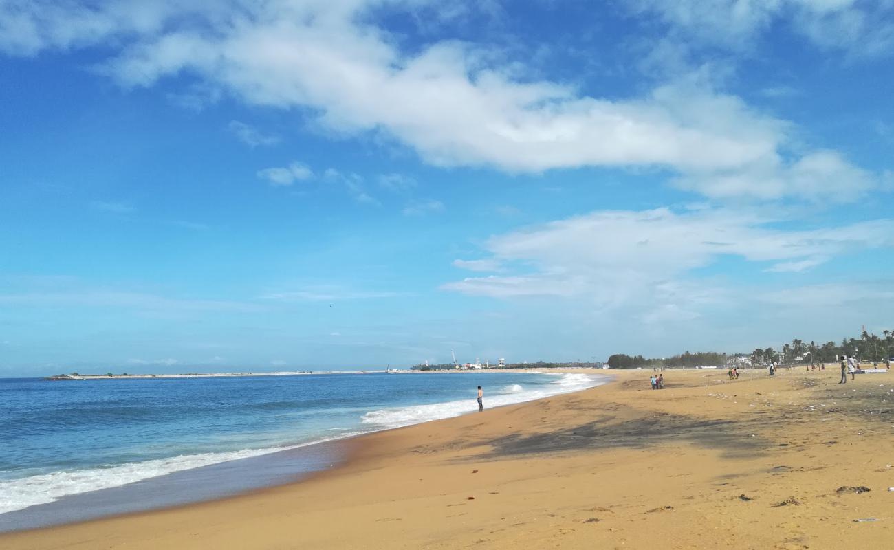 Photo of Kollam Beach with bright sand surface