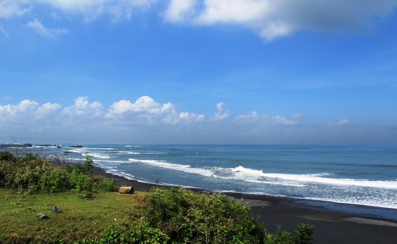 Photo of Nyanyi Beach with black sand surface