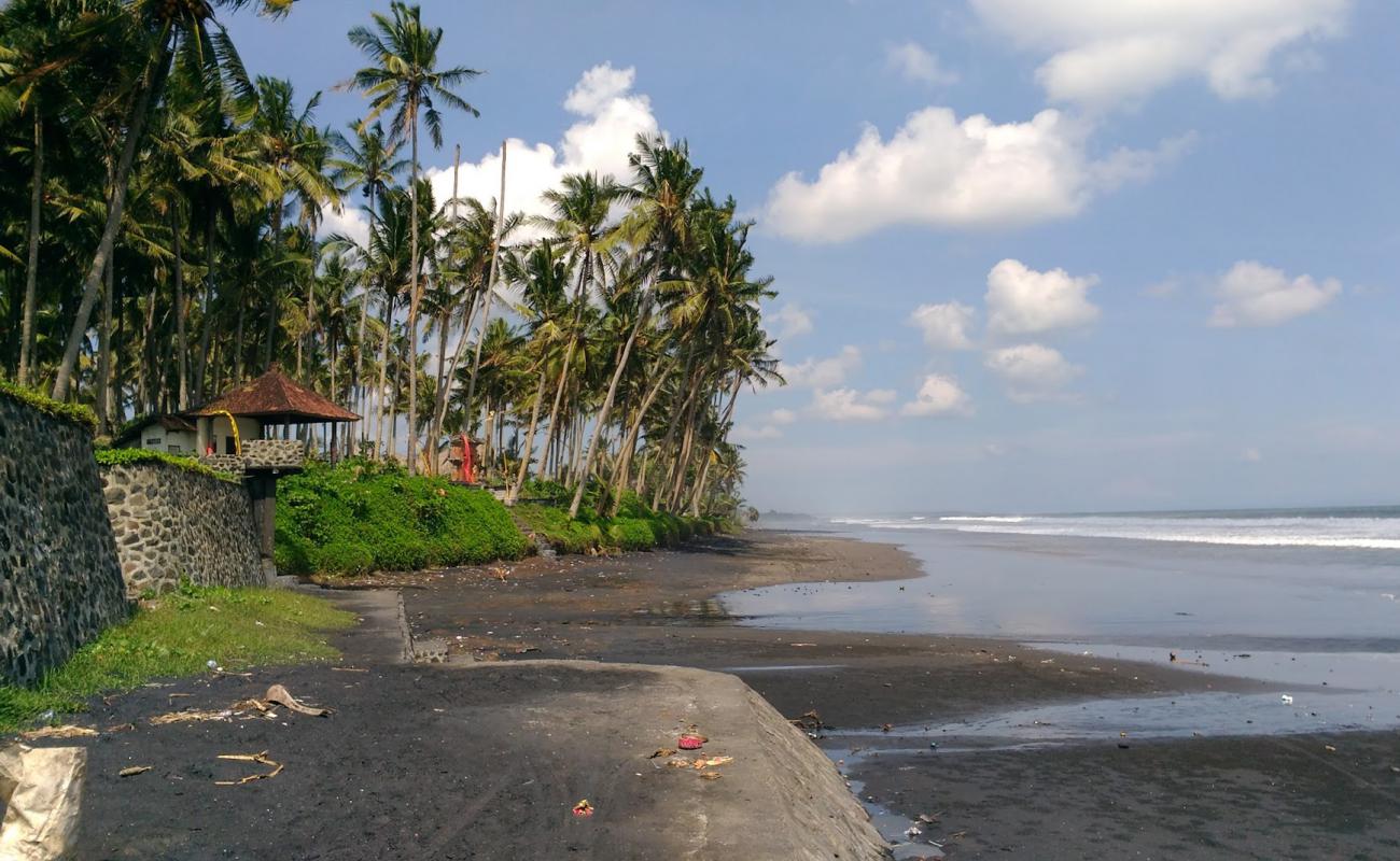 Photo of Pasut Beach with black sand surface