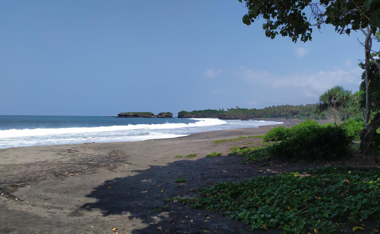 Photo of Kelecung Beach with black sand surface