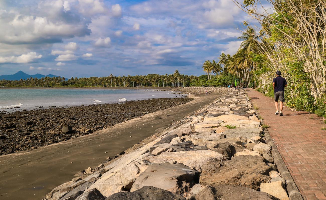 Photo of Baluk Rening Beach with brown sand &  rocks surface