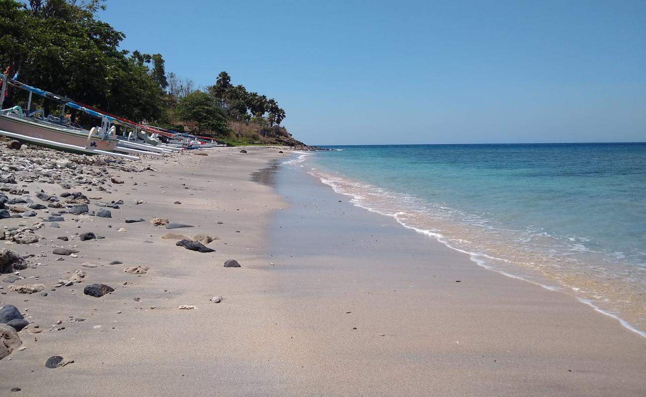 Photo of Ibus Beach with gray sand surface