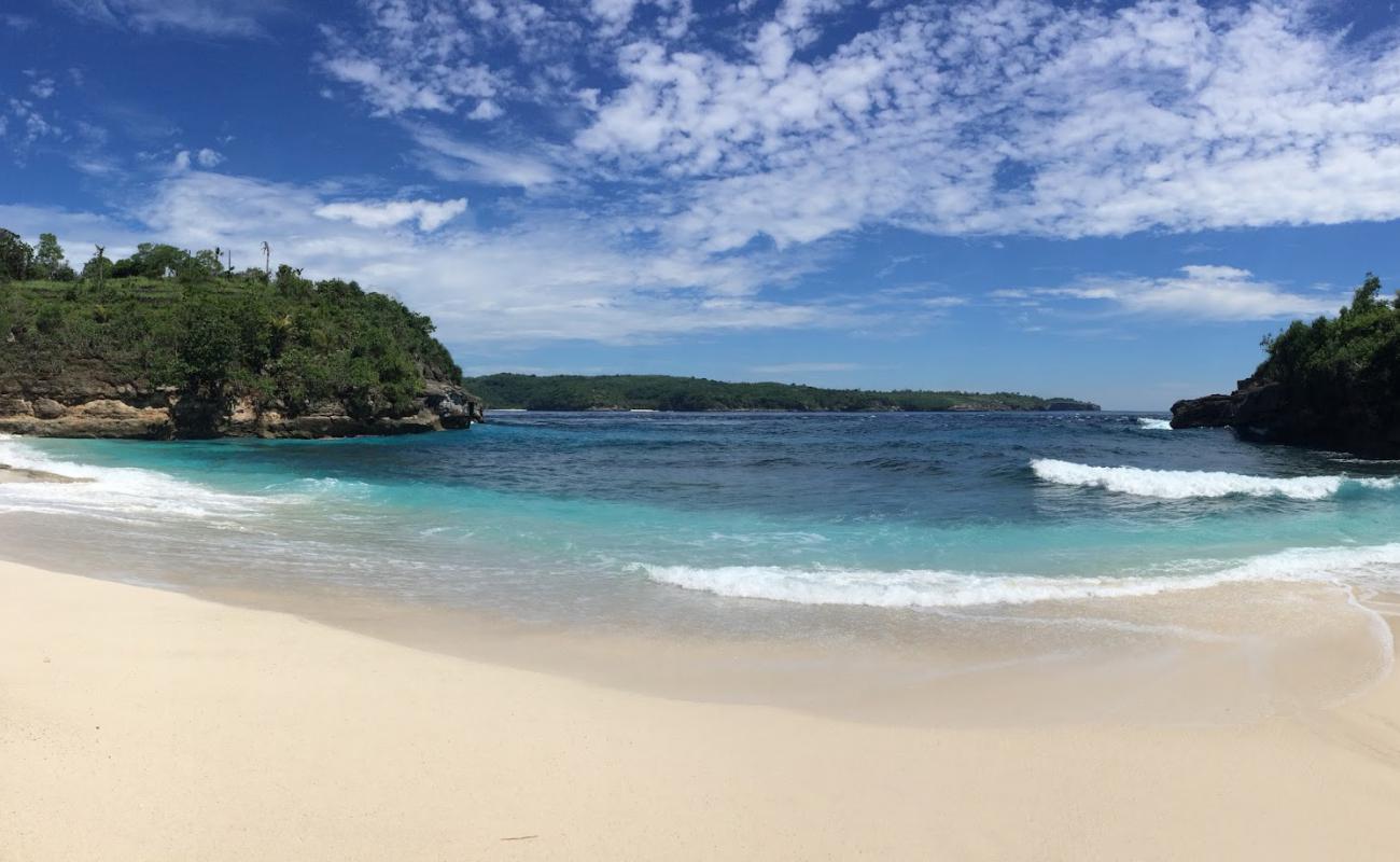 Photo of Secret Beach with bright sand & rocks surface