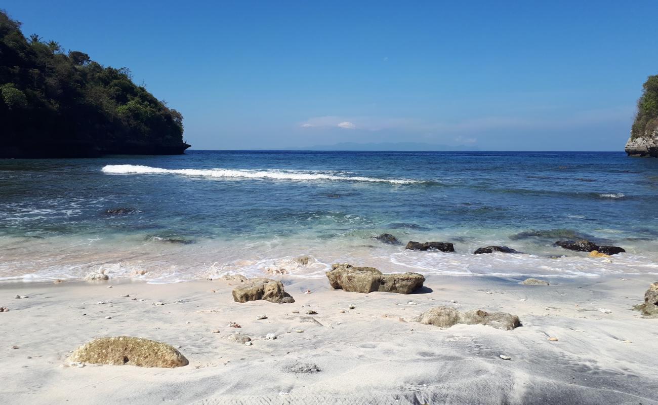 Photo of Sebele beach with gray sand &  rocks surface