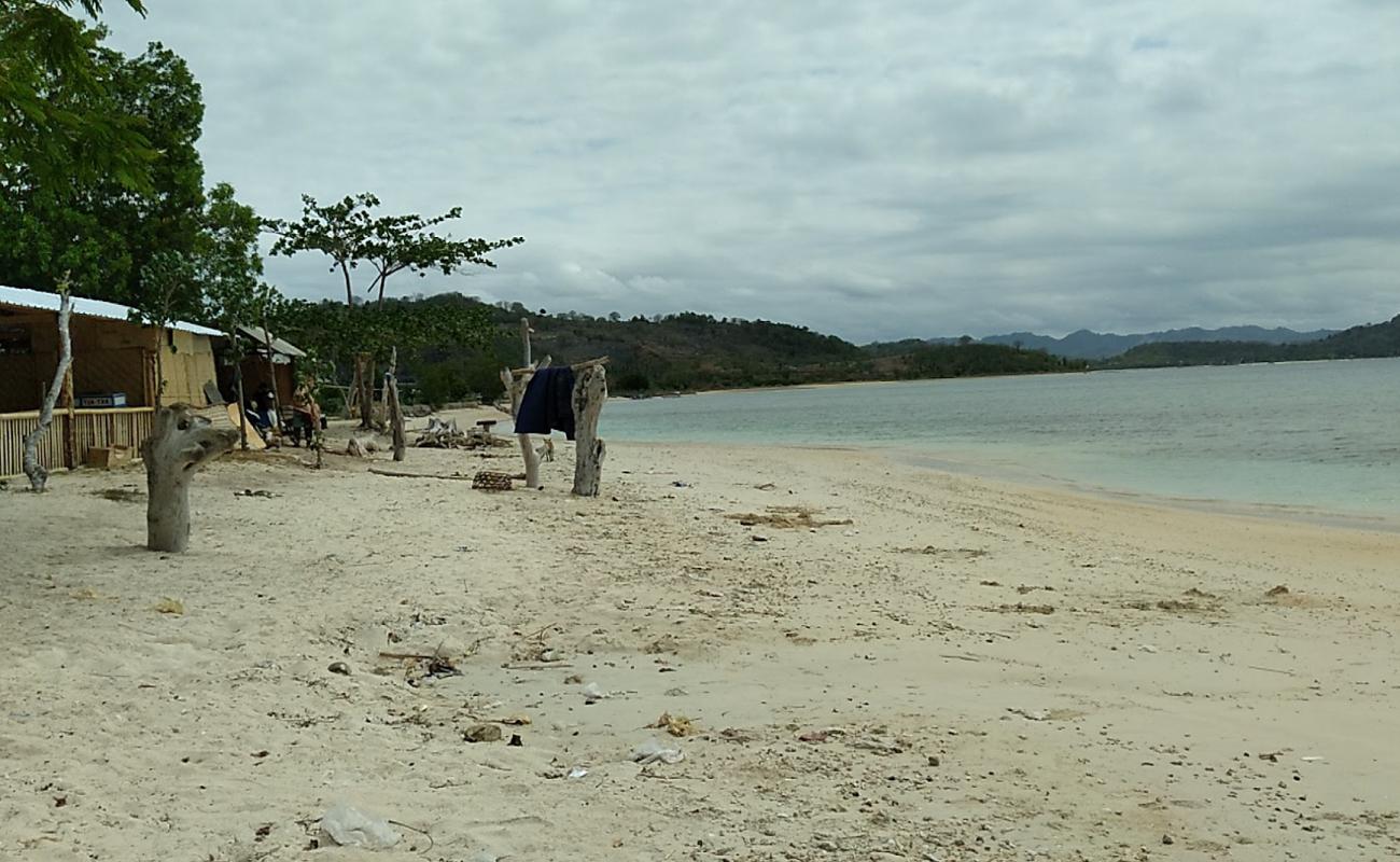 Photo of Pesisir Mas Beach with bright sand & rocks surface