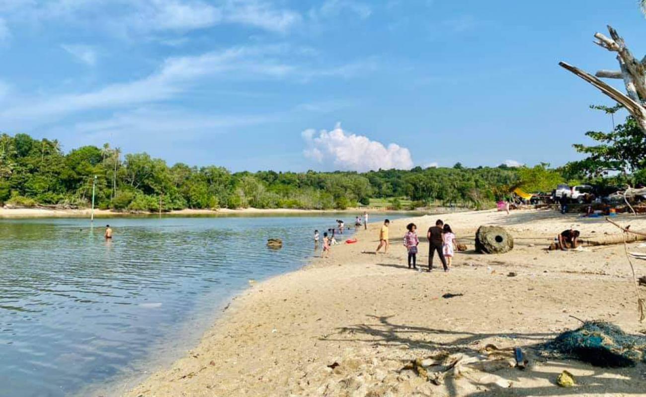 Photo of Bahagia Beach with bright shell sand surface