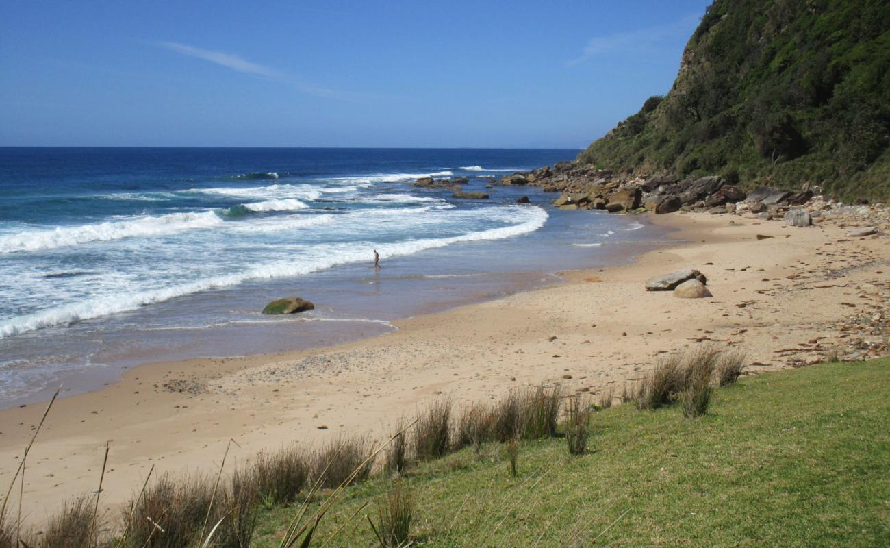 Photo of Werrong Beach with bright sand & rocks surface