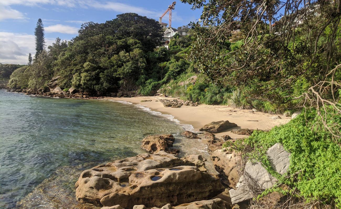 Photo of Queens Beach with bright sand surface