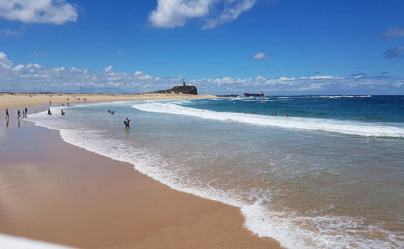 Photo of Nobbys Beach with bright sand surface