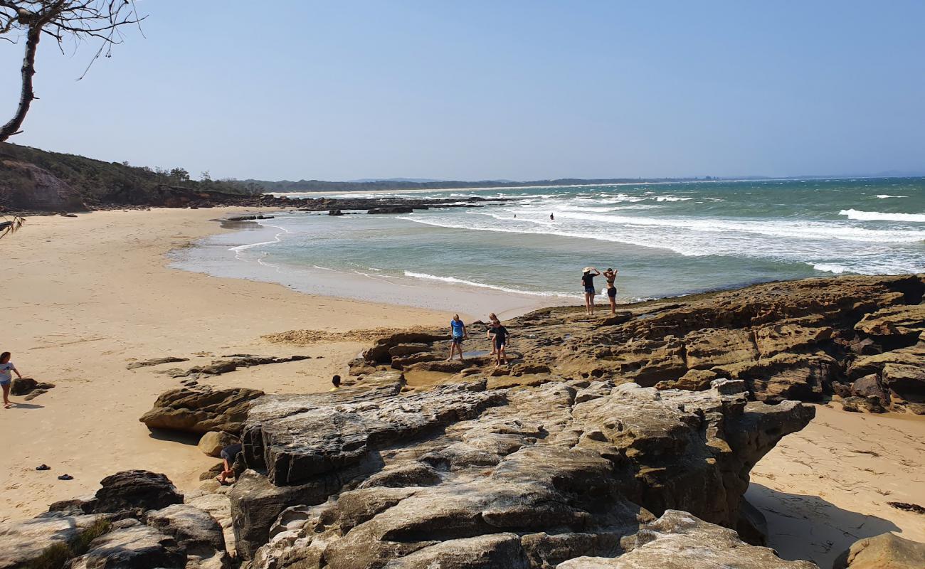 Photo of Bartletts Beach with bright sand & rocks surface