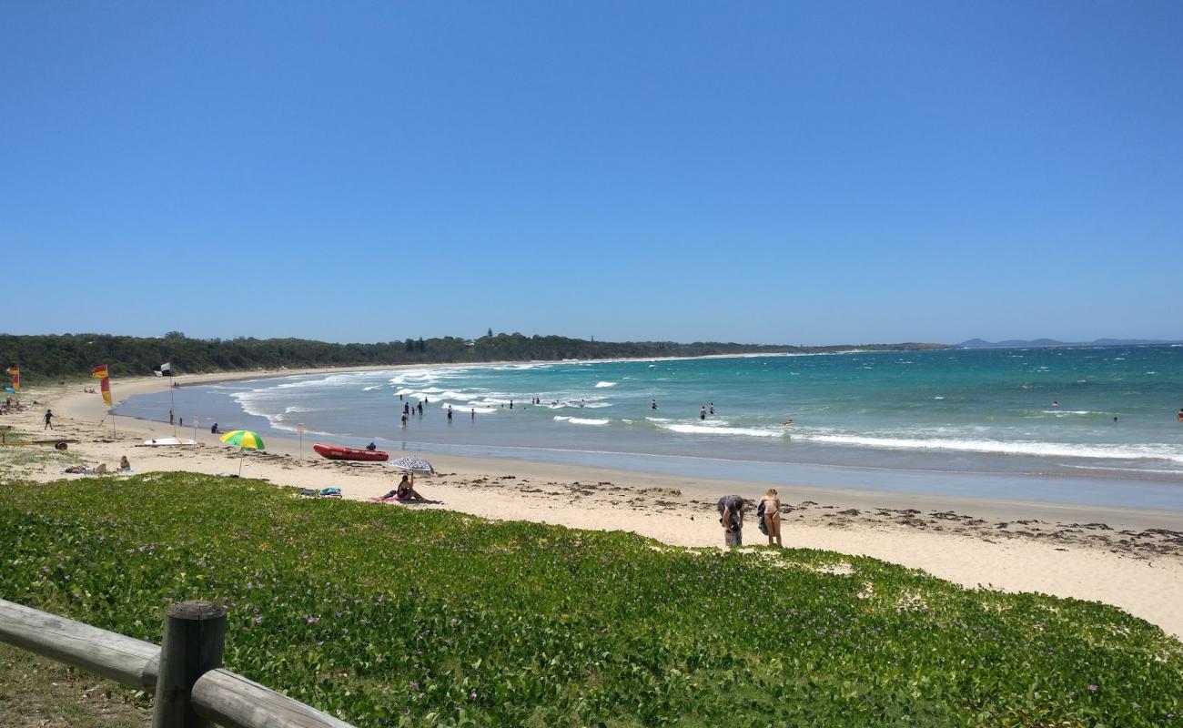 Photo of Woolgoolga Beach with bright fine sand surface