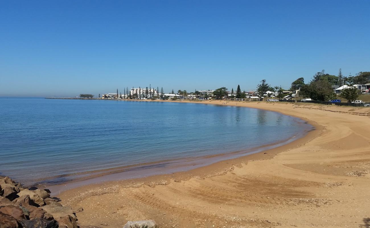 Photo of Queens Beach with bright sand surface