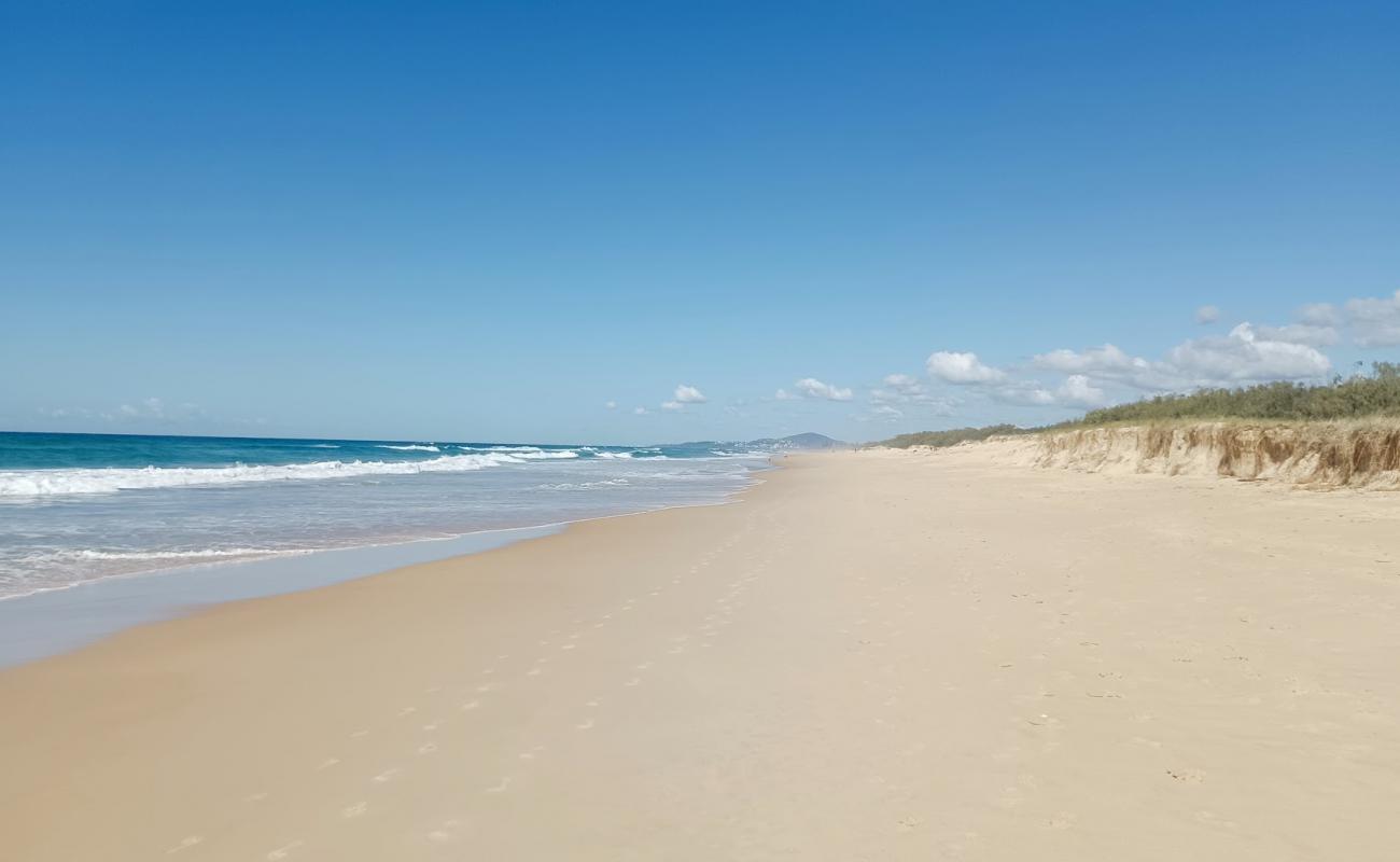 Photo of Marcus Beach with bright fine sand surface