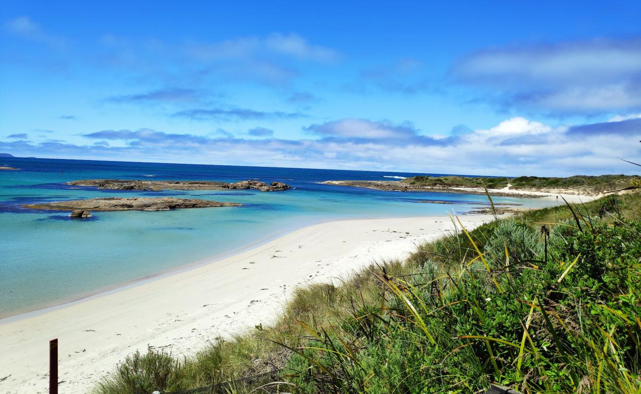 Photo of Peaceful Bay Beach with bright sand surface