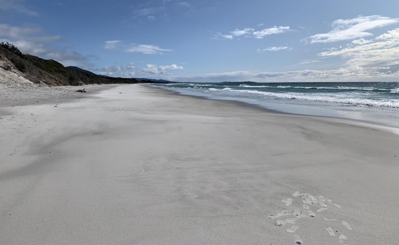 Photo of Denison Beach with white sand surface